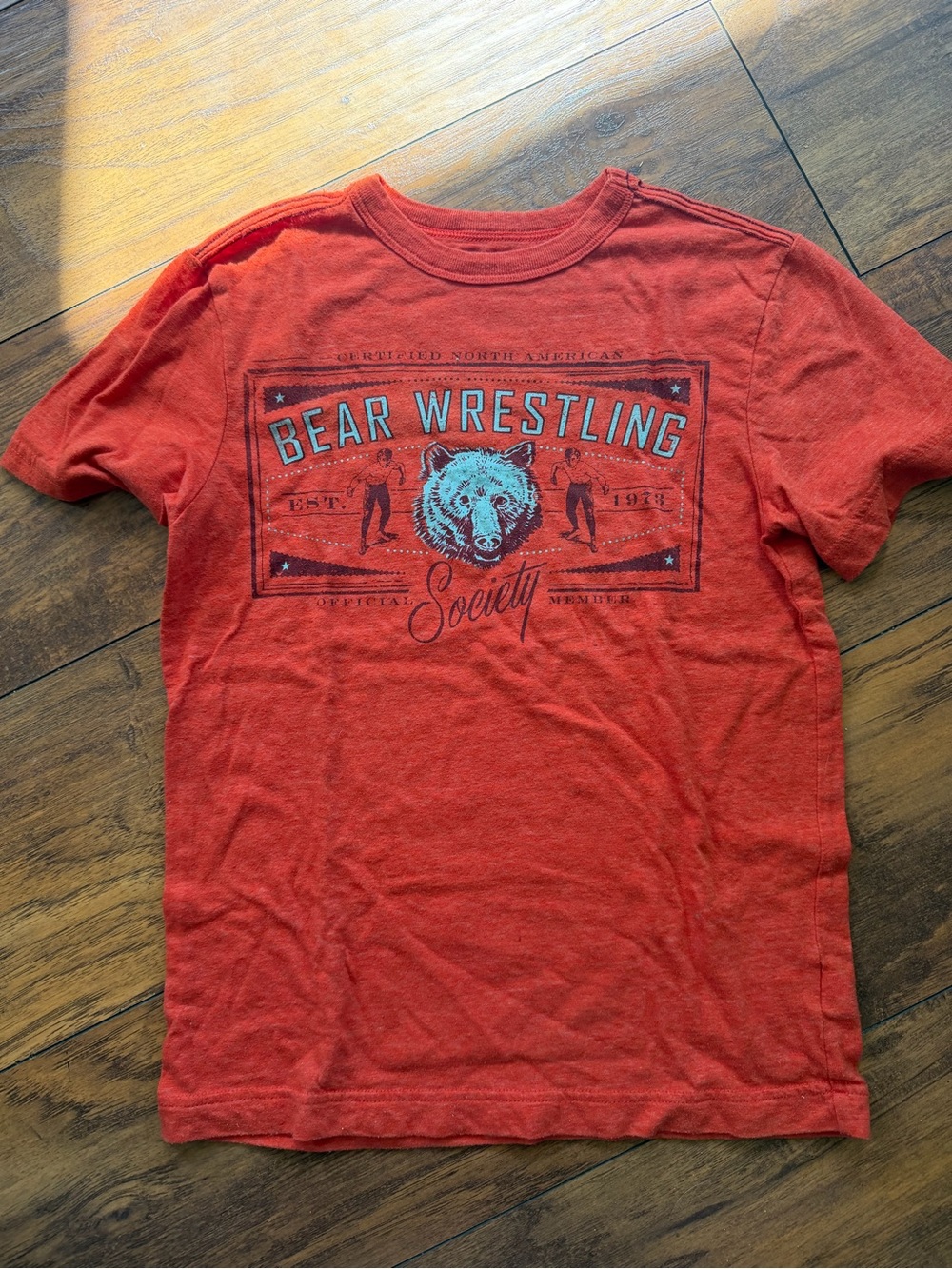 Cherokee Orange Bear Wrestling Graphic Short Sleeve Tee